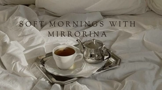 Soft Mornings with Mirrorina featuring tea in bed, elegant white bedding, and peaceful morning rituals designed to inspire beauty, comfort, and intentional living.