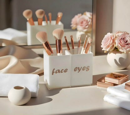 Face & Eyes brush set by Mirrorina on a beige table with mirror in the background, brushes in the holder, styled with a vase of flowers.